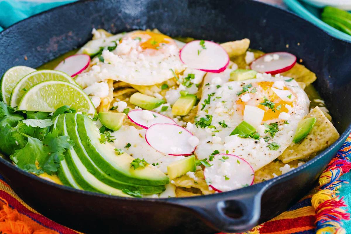 Chilaquiles verdes in a skillet.