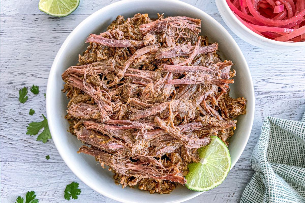 Shredded barbacoa in a bowl.