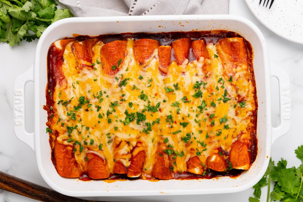 Enchiladas in a baking dish.