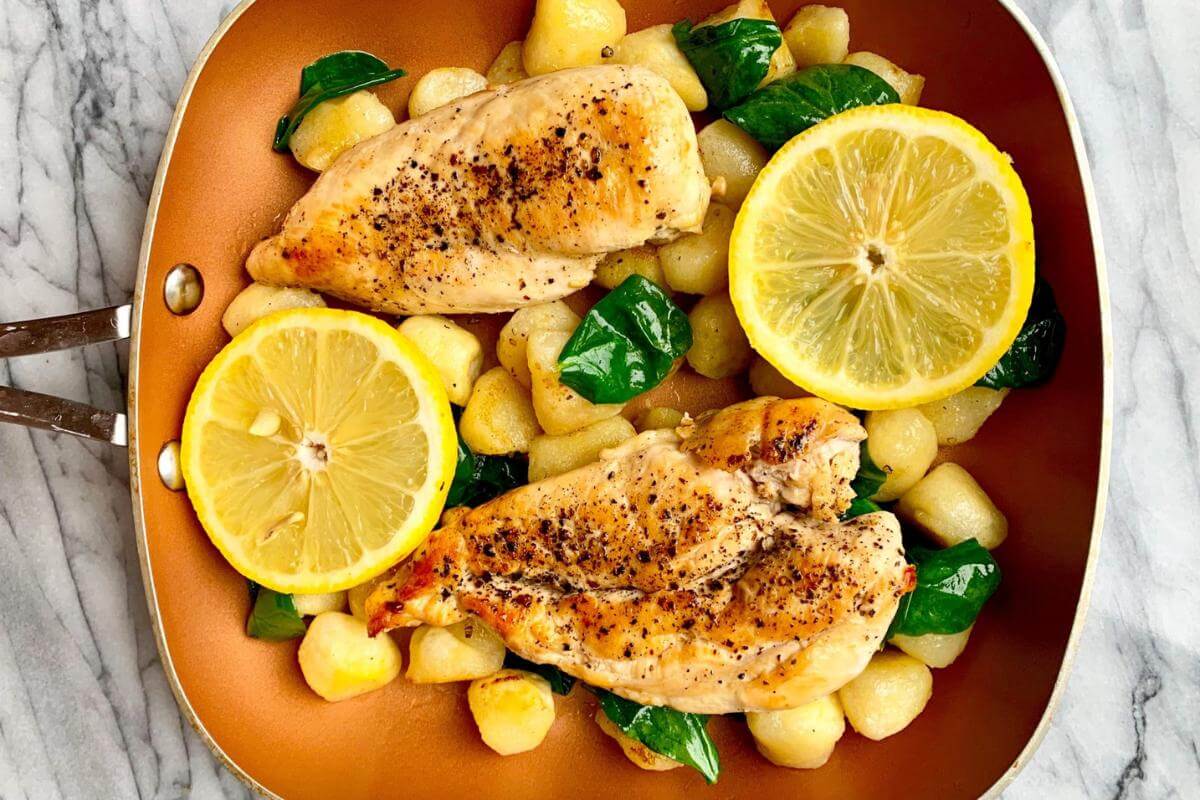 Lemon chicken in a pan.