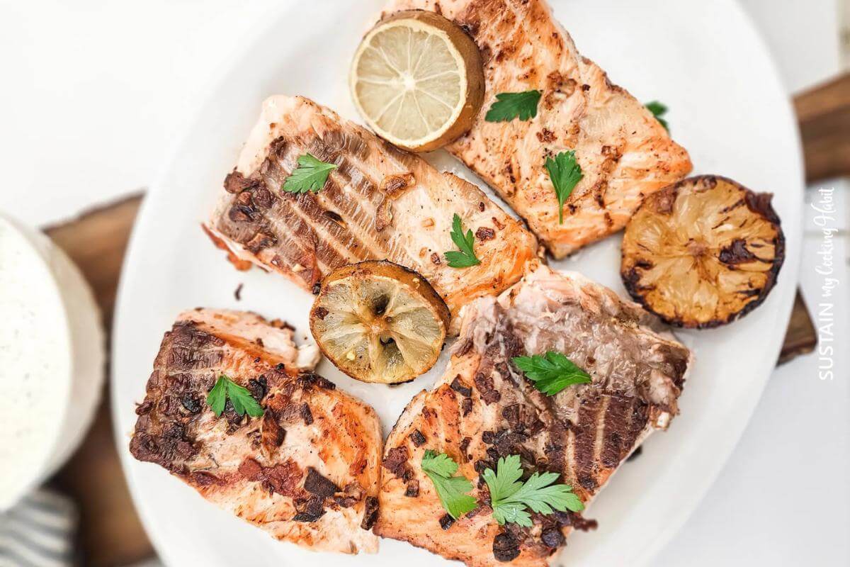 Slices of cooked salmon on a plate.