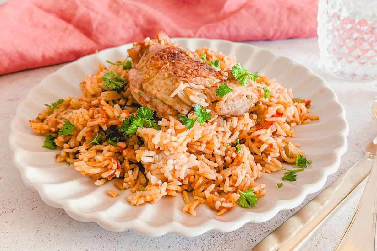 A plate of mexican chicken and rice.