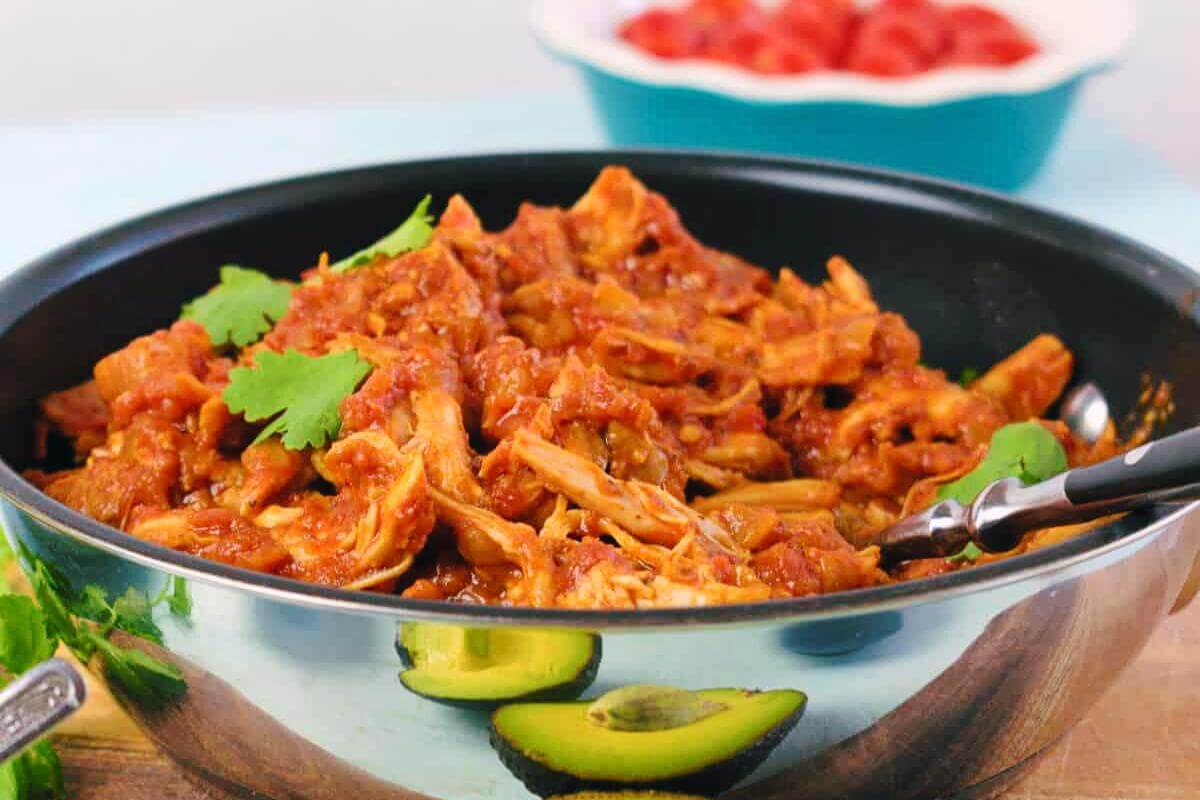 Shredded chicken tinga in a bowl.