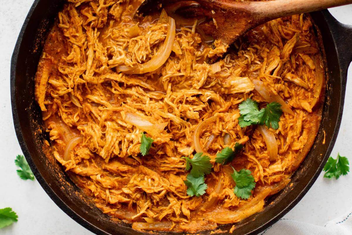 A bowl of shredded chicken tinga.