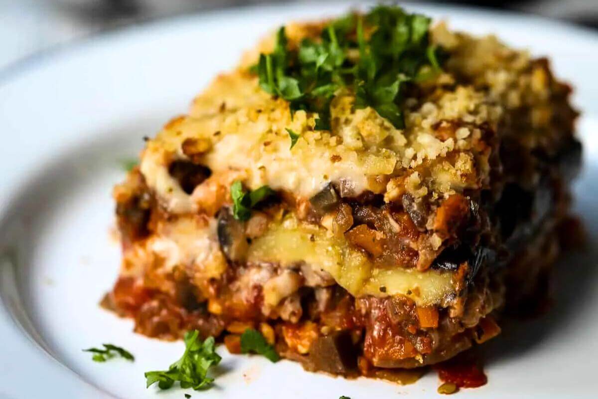 A slice of eggplant lasagna on a plate.