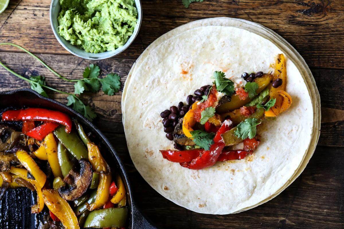 Vegge fajitas in a tortilla.