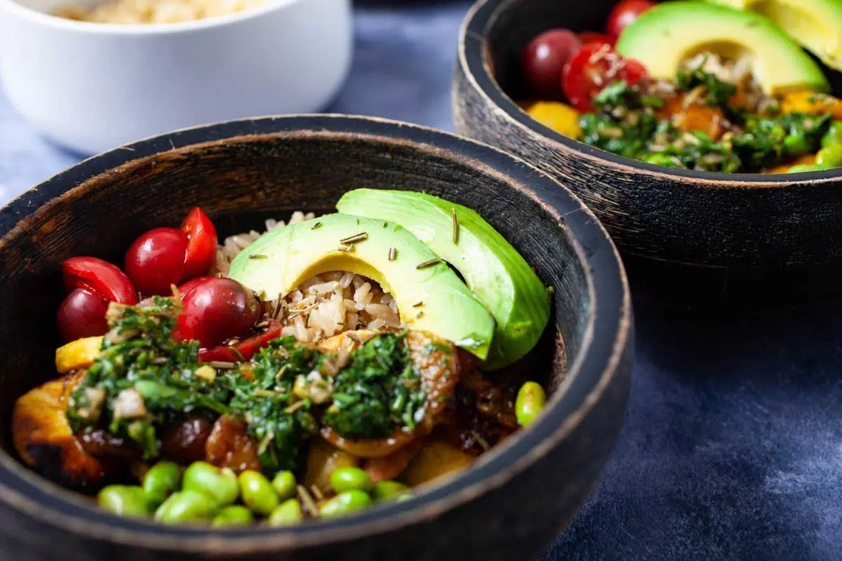 Avocado Plantain Rice Bowl topped with fresh avocado slices.