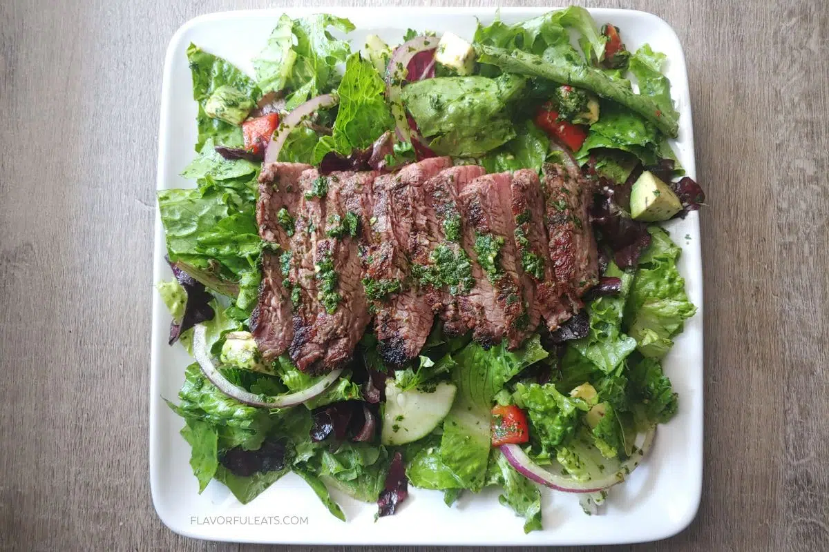Chimichurri steak salad on a plate.