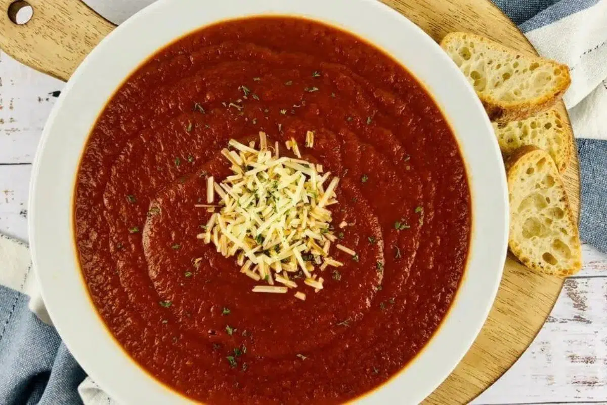 Gluten Free Tomato Soup alongside bread slices.