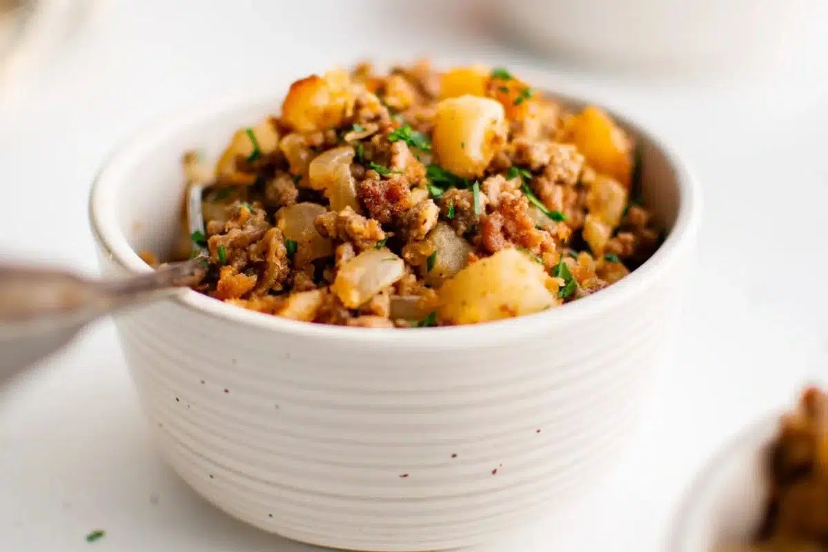 Ground beef and potatoes in a bowl.
