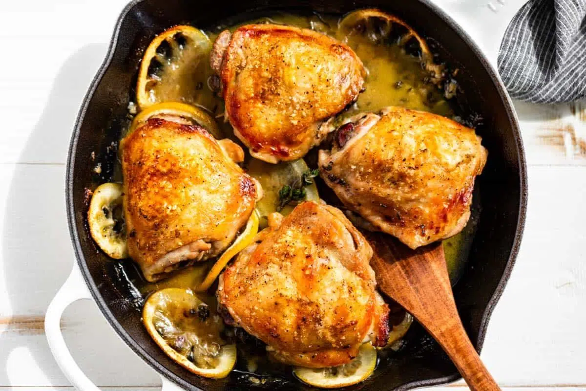 Lemon Chicken Thighs in a pan.