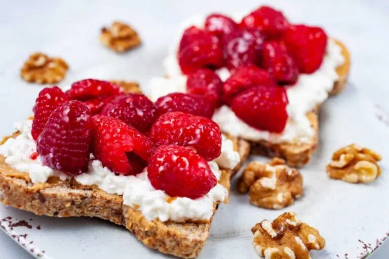 Peanut Butter Cottage Cheese Toast With Fresh Berries served on a plate.