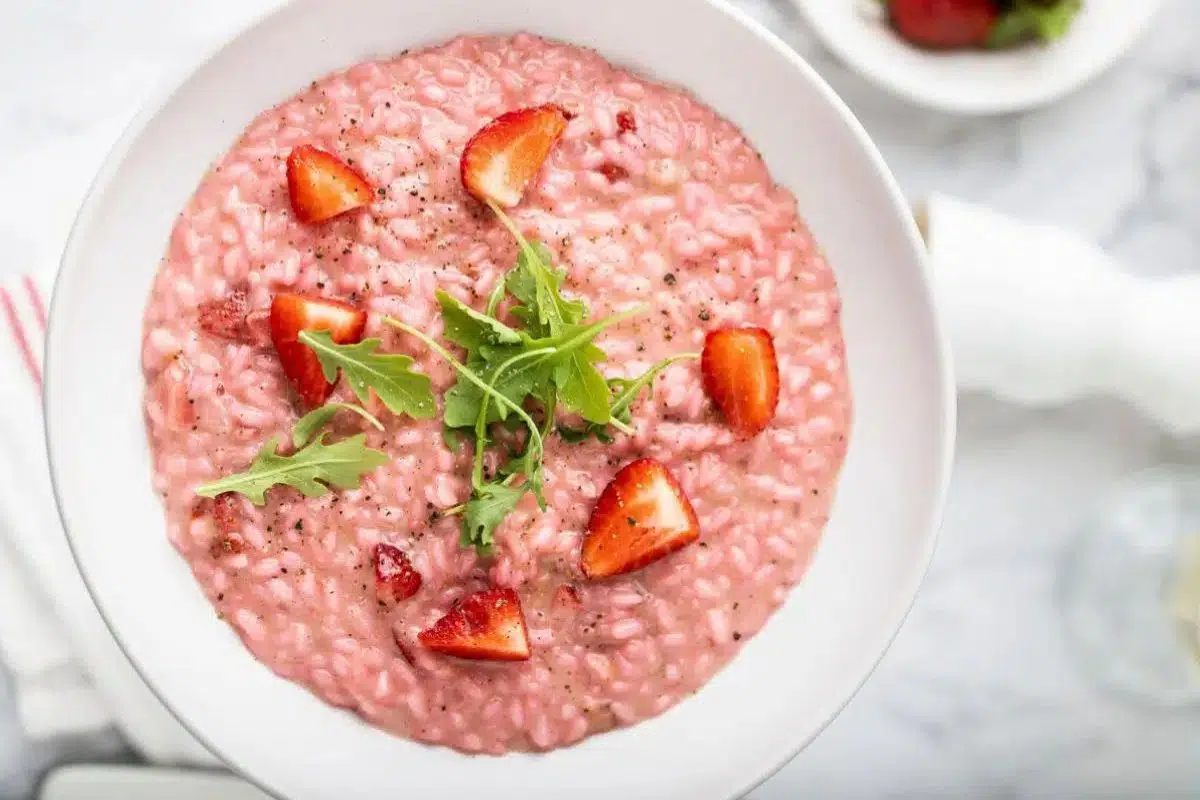Strawberry Risotto topped with fresh strawberry slices.