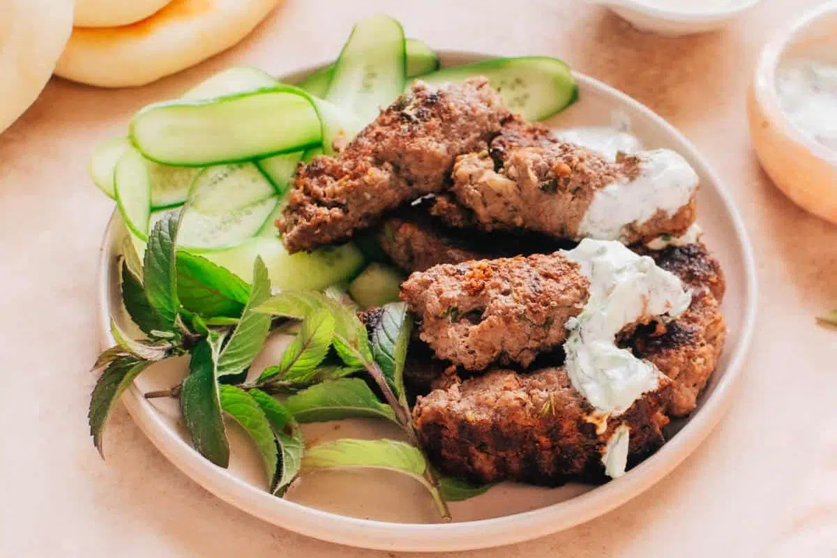 Beef Kafta with veggies on a plate.