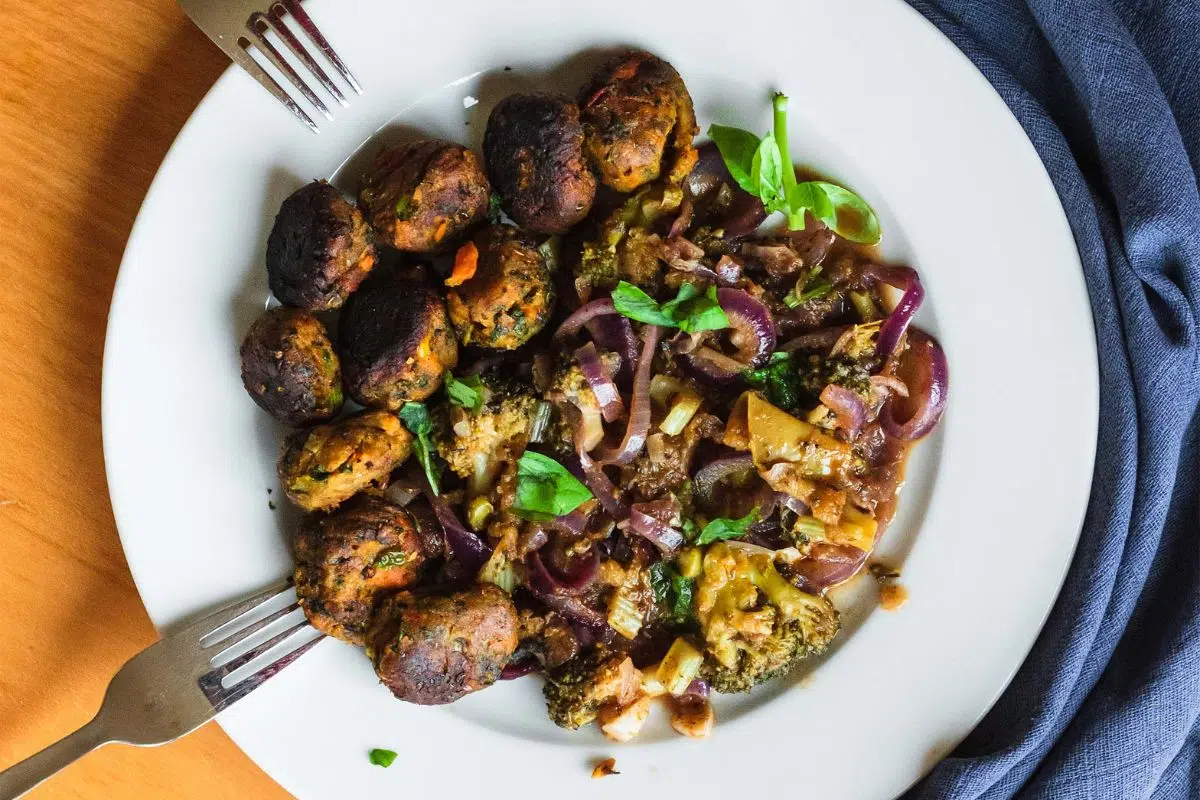 Vegetable Stew with Onion, Broccoli, and Cauliflower on a plate.