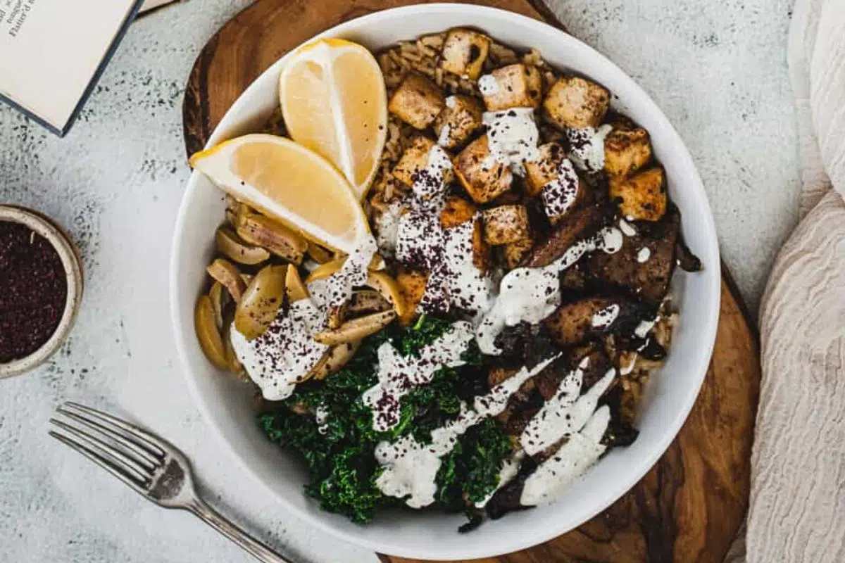 Middle Eastern Tofu Rice Bowl topped with fresh lemon slices.