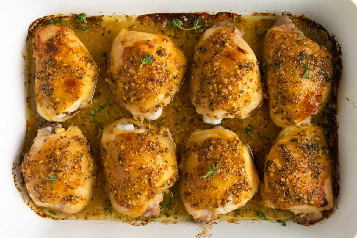 Baked Honey Dijon Mustard Chicken Thighs in a baking dish.