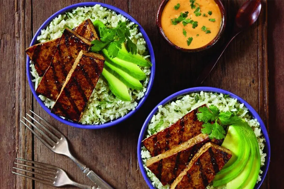 Balsamic Grilled Tofu with cauliflower cilantro rice and avocado.