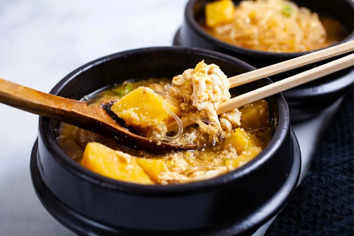 A bowl of Bone Broth Breakfast With Eggs And Plantain.