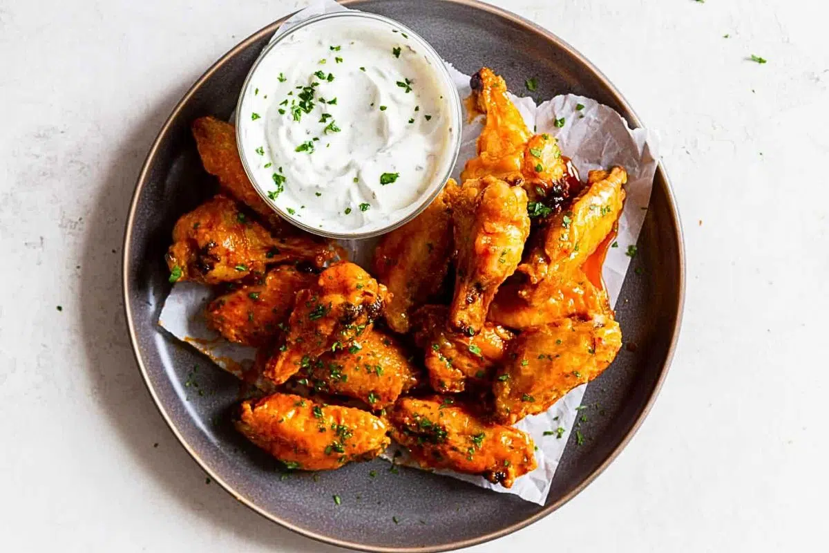 Crispy Air Fryer Chicken Wings served with dipping sauce.