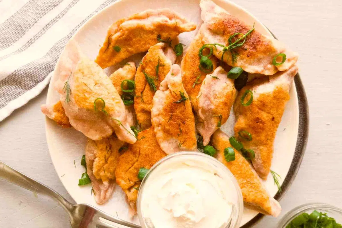 Easy Gluten-Free Pierogi topped with chopped spring onion.