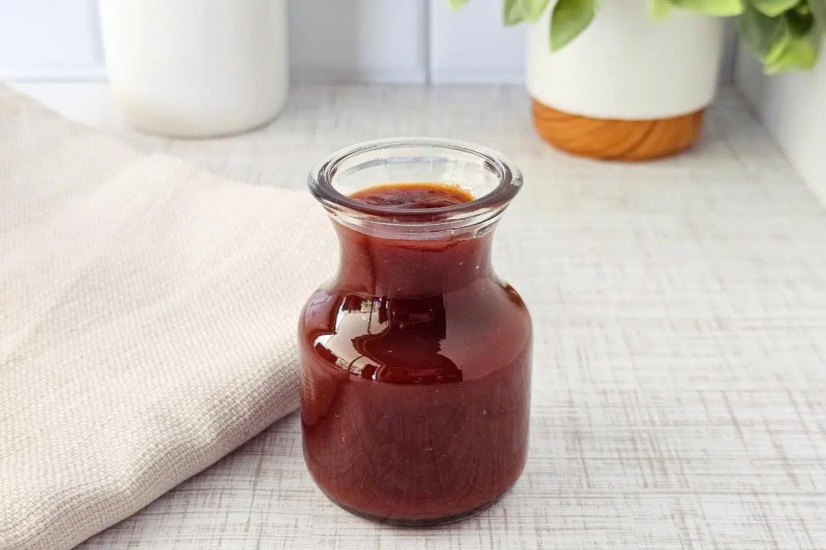 Easy Homemade Gluten-Free BBQ Sauce in glass container.