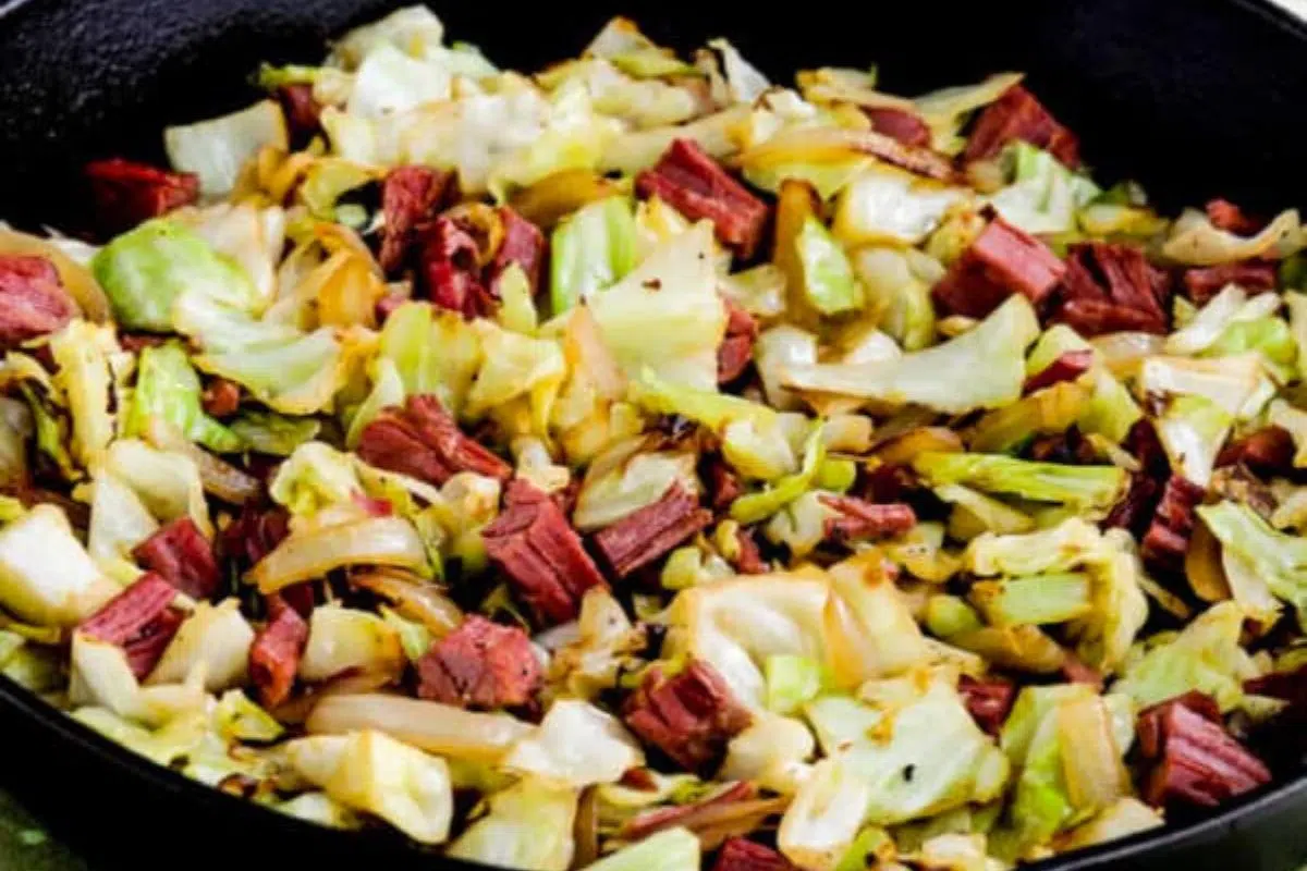 Fried Cabbage with Corned Beef in a pan.