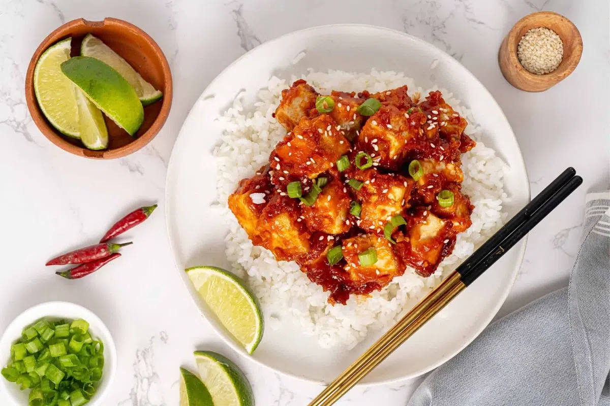 General Tso’s Tofu garnished with spring onions.