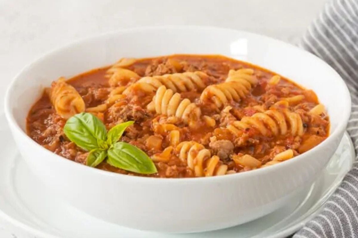 Gluten Free Lasagna Soup topped with basil leaves.
