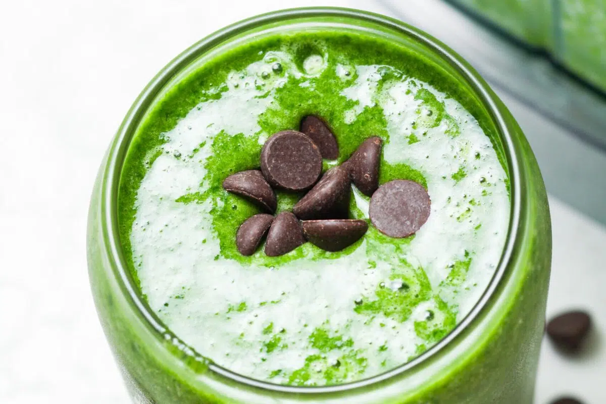 Healthy Shamrock Shake topped with dark chocolate chips.