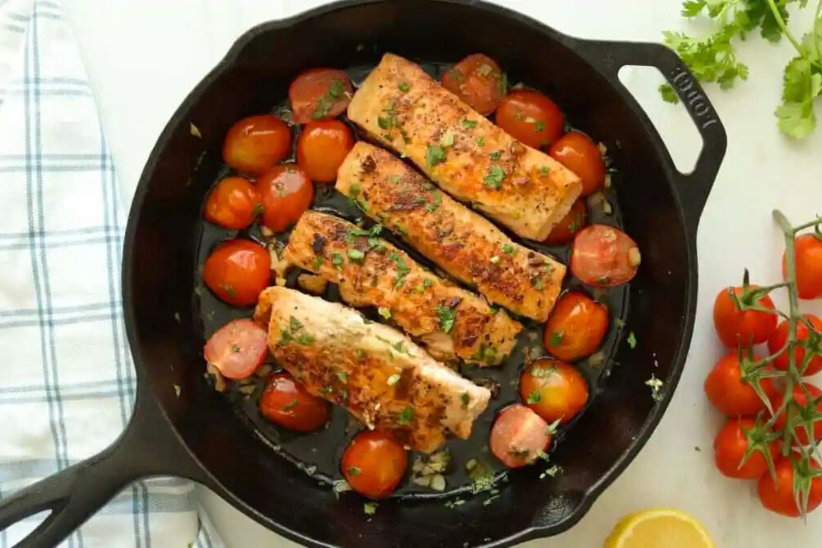 Lemon Garlic Salmon with Tomatoes served in a pan.