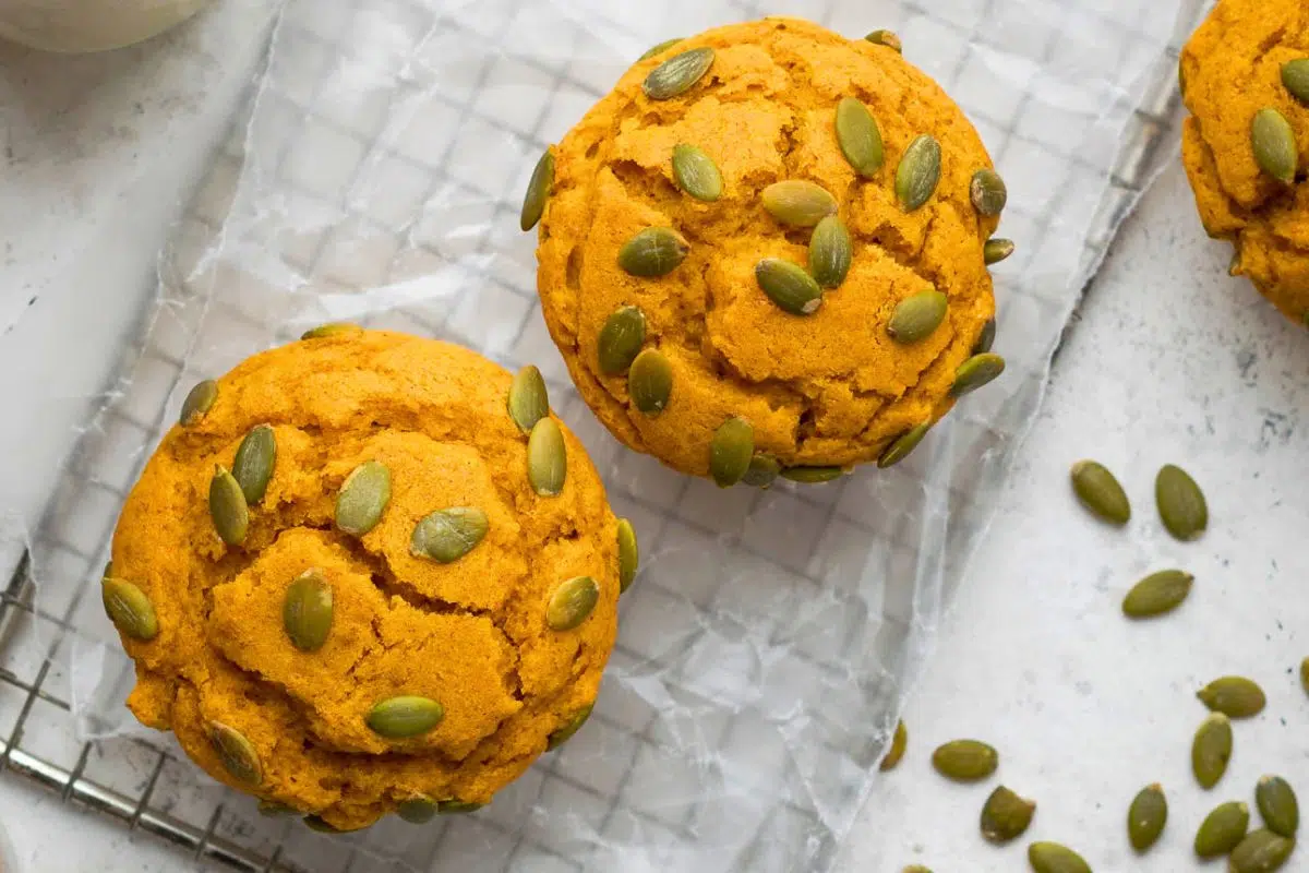 Gluten Free Pumpkin Muffins topped with pumpkin seeds.