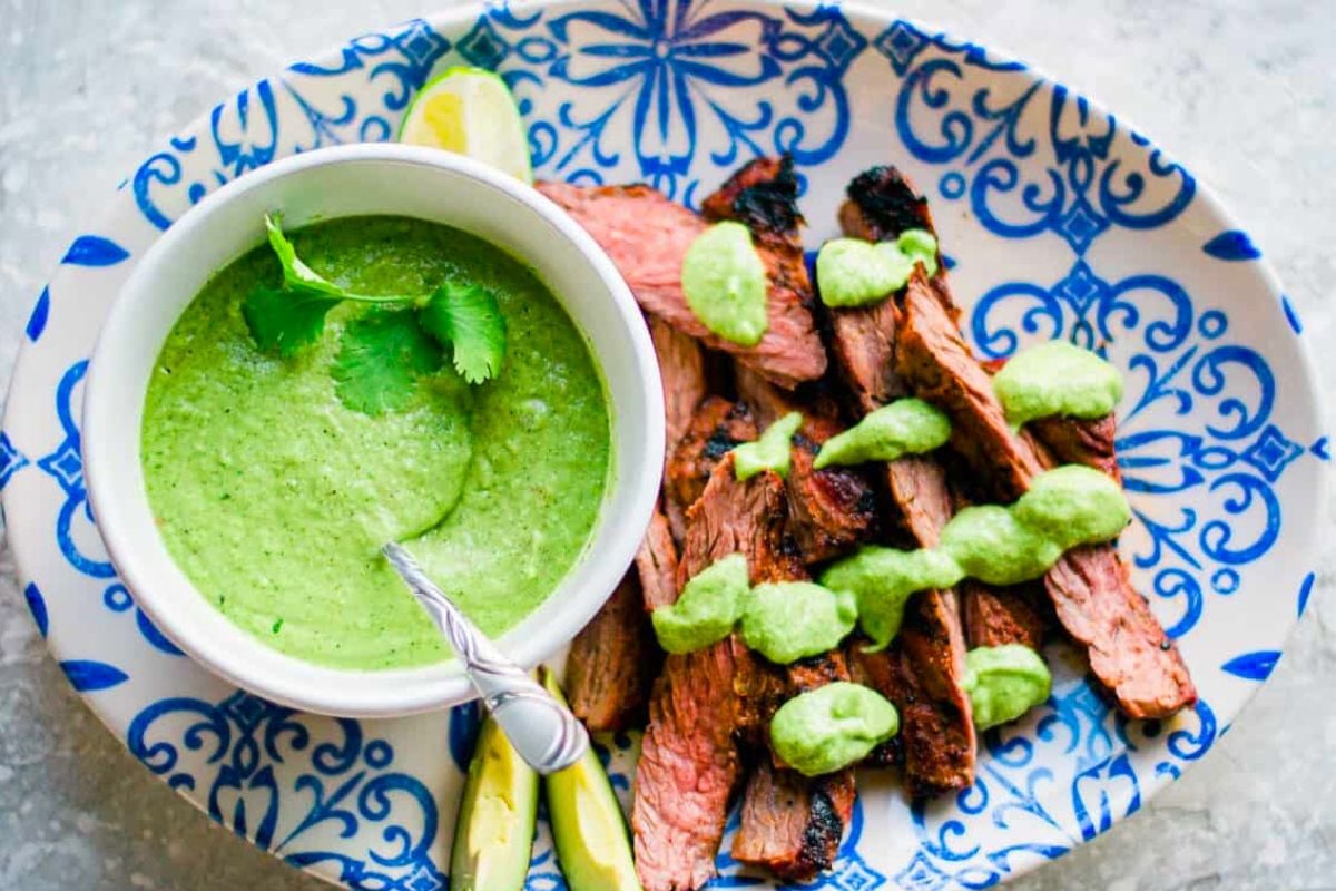 Quick and Easy Carne Asada with Guasacaca Sauce served on a plate.