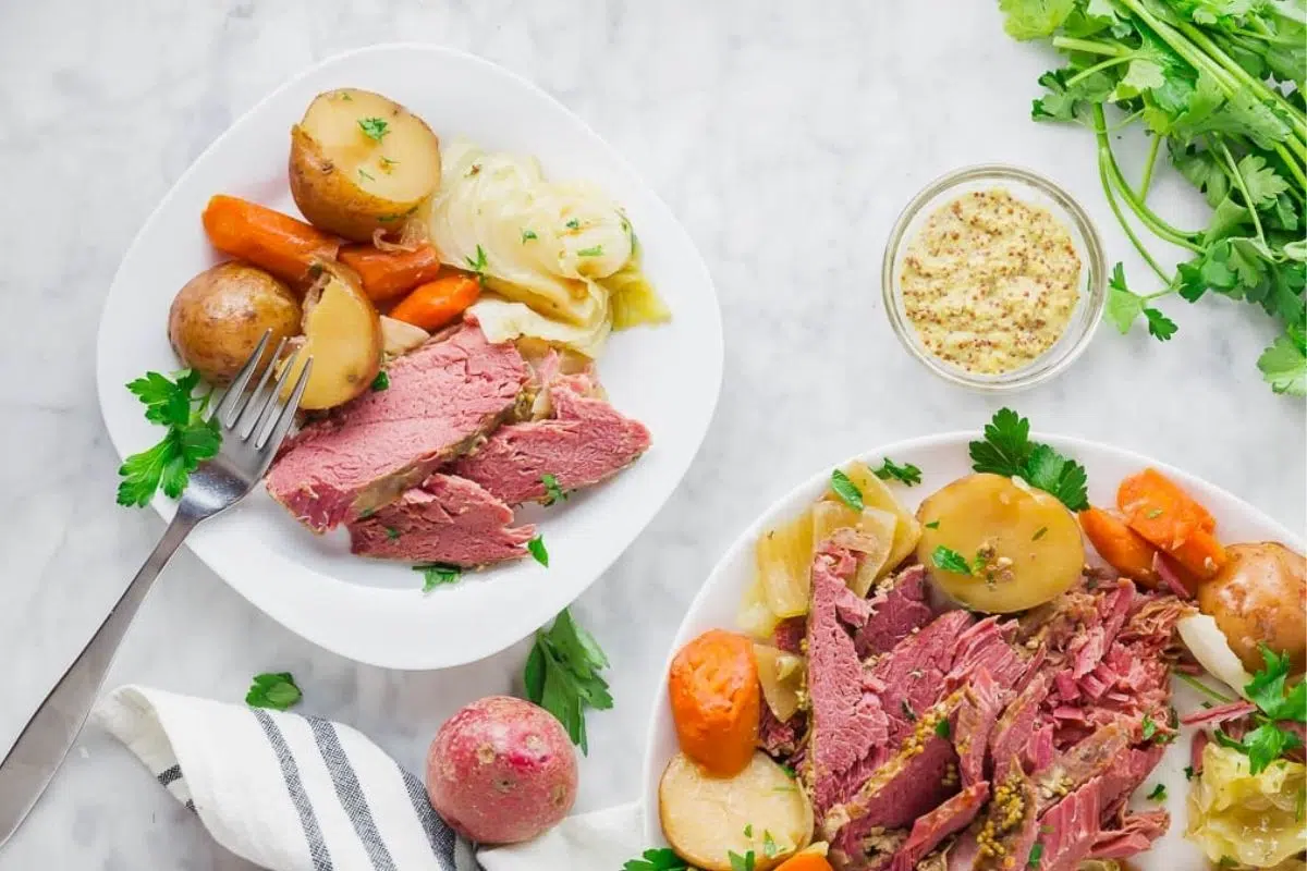 Slow Cooker Corned Beef served with veggies.