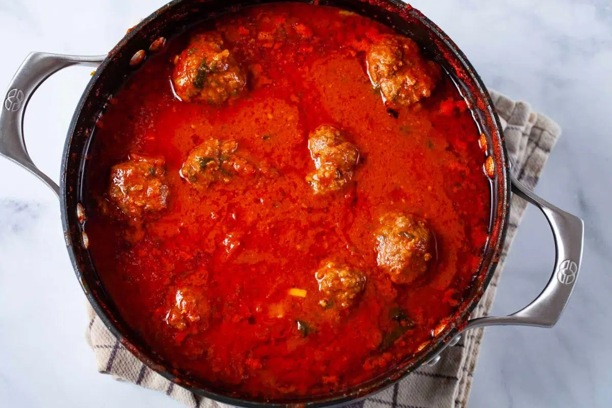 Tender Italian Meatballs In Tomato Sauce in a pot.