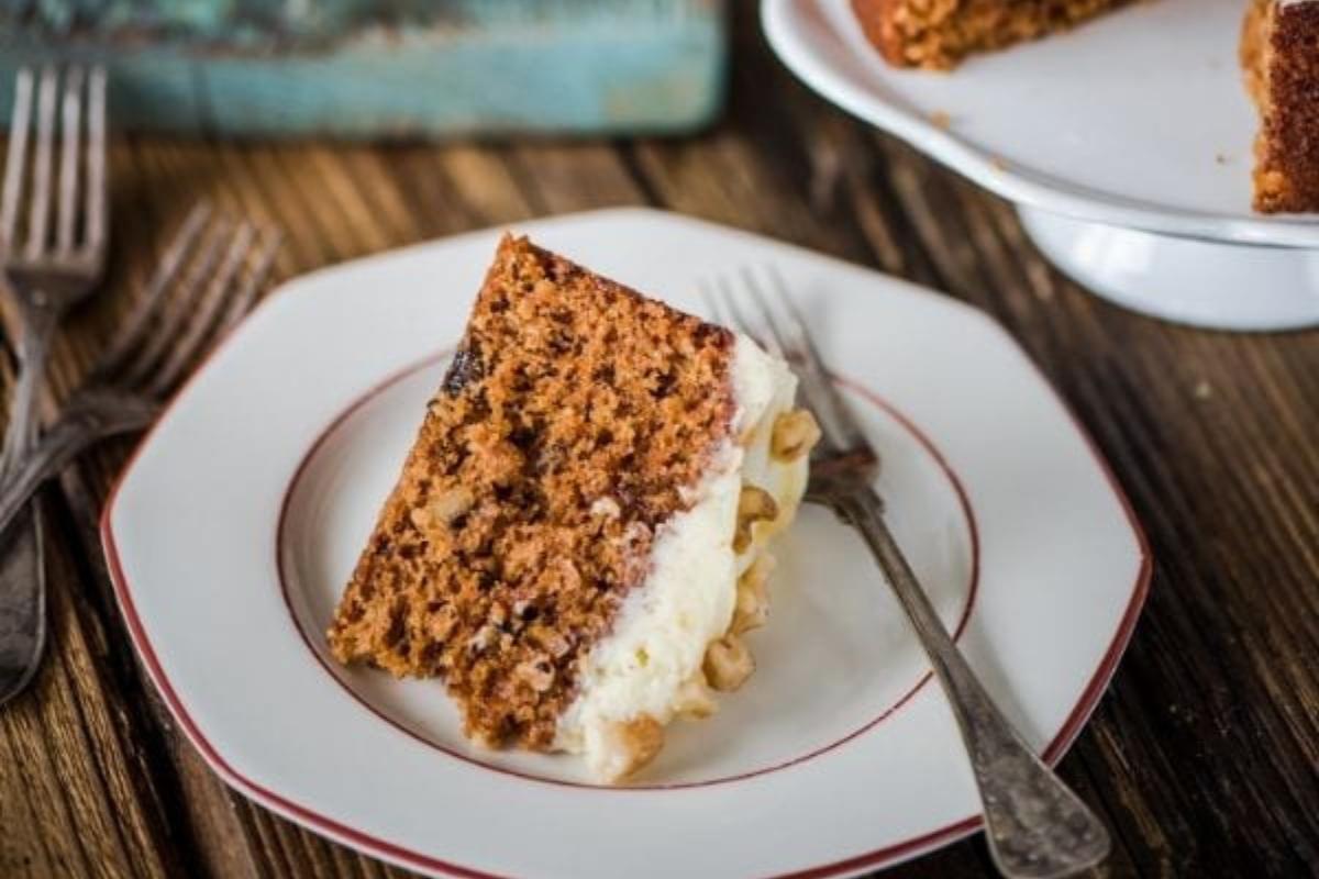 A slice of Keto Carrot Cake with Cream Cheese Frosting.