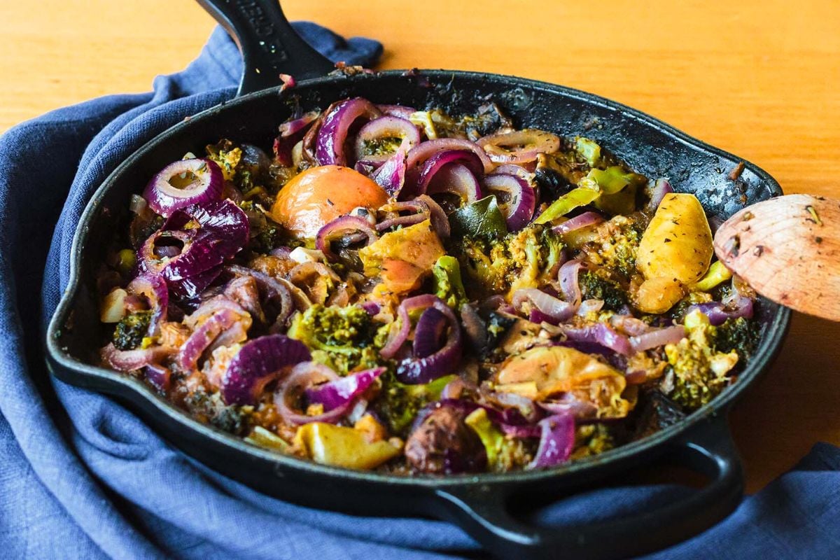 Vegetable Stew with Onion, Broccoli, and Cauliflower served in a skillet.