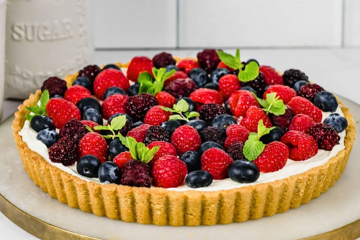 Mixed Berry Tart served on a plate.