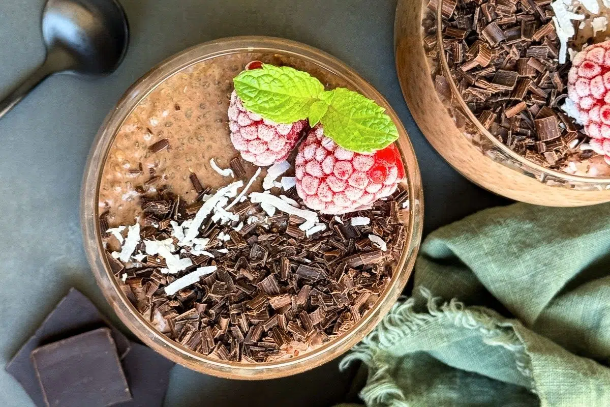 Chocolate Chia Pudding topped with frozen raspberries.