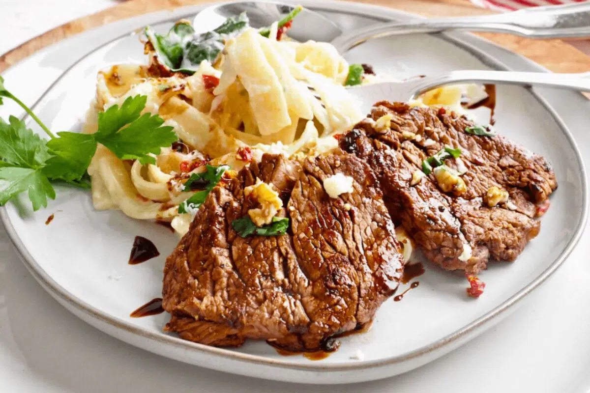Copycat Steak Alfredo served on a plate.