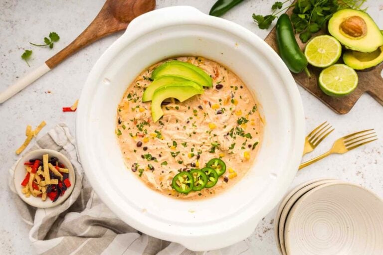 Crockpot White Chicken Chili topped with avocado slices.