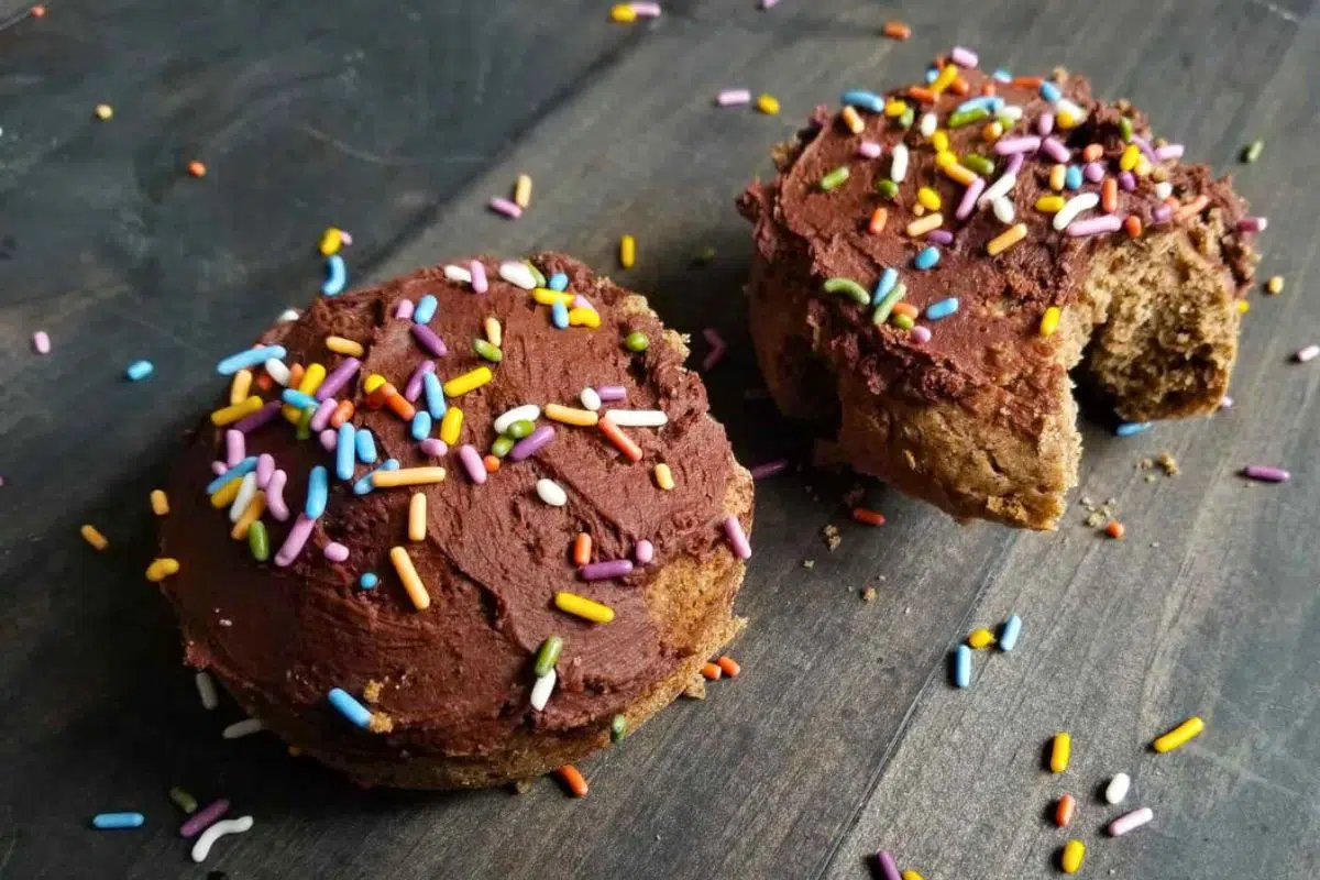 Delicious Gluten Free Donuts topped with rainbow sprinkles.