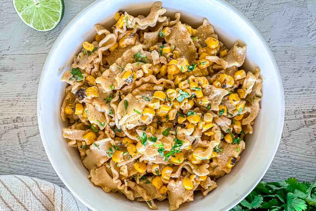 Easy Elote Pasta Salad garnished with chopped cilantro.