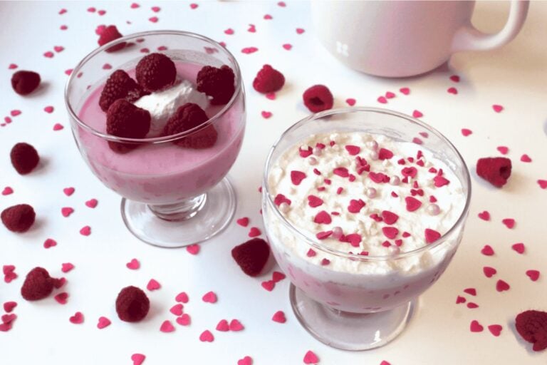 Easy Greek Yogurt Jello Fluff topped with raspberries.
