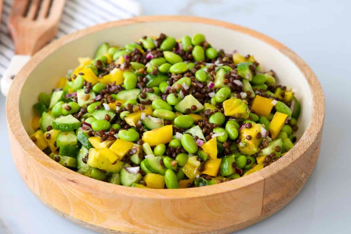 Edamame Salad served in a wooden bowl.