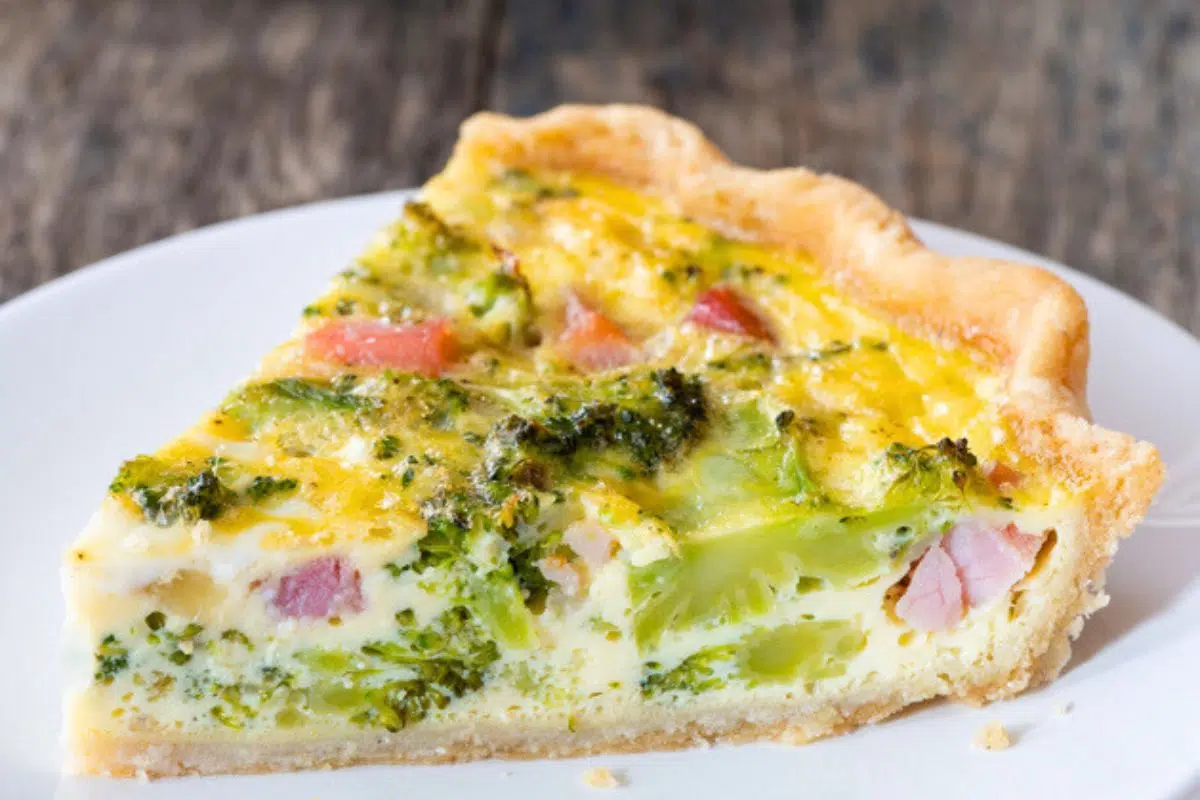 A slice of Gluten Free Quiche Recipe with Ham served in a plate.
