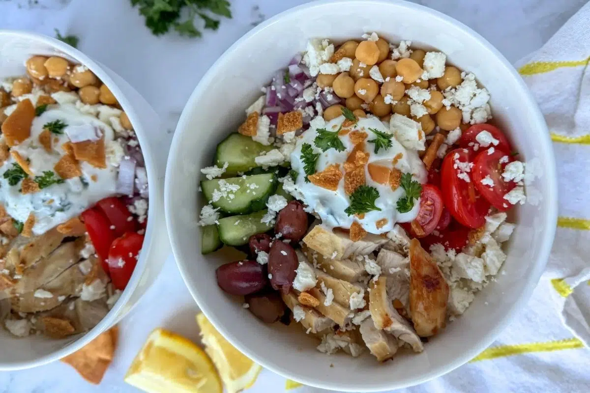 Bowls of Greek Chicken Protein Bowls with Garlic Yogurt.