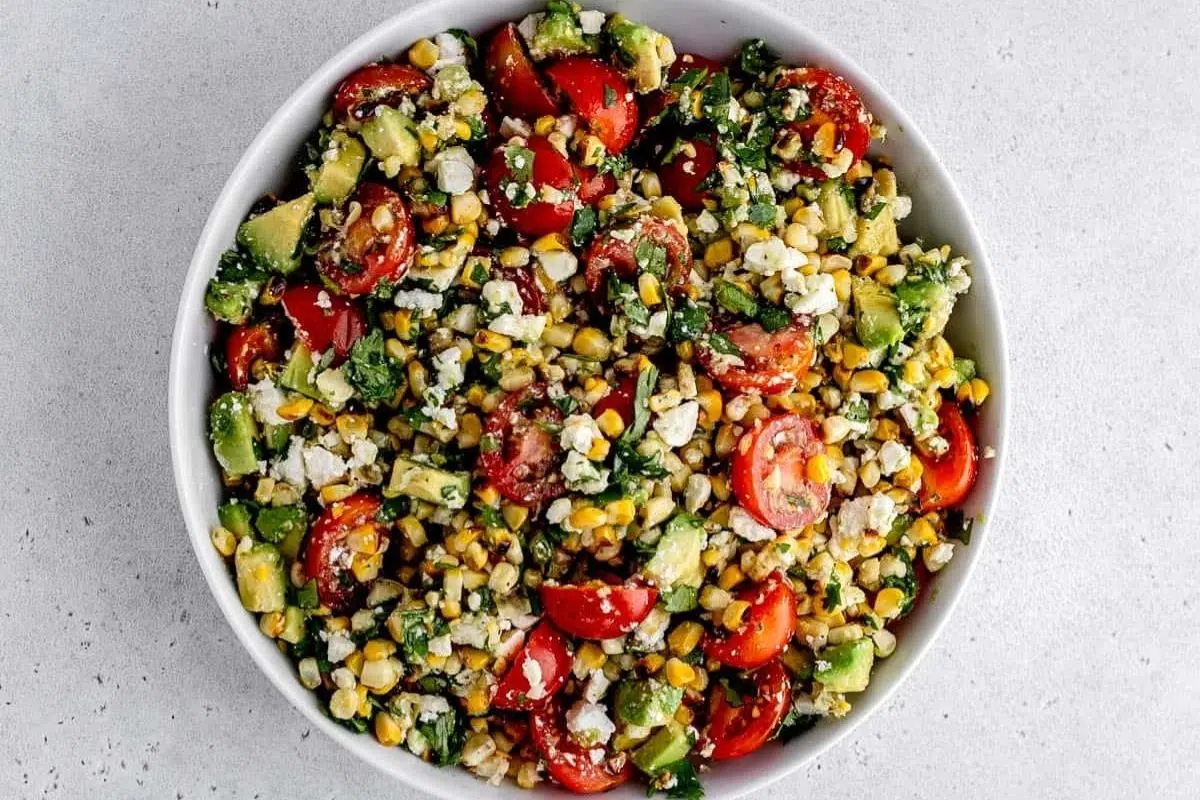 Grilled Corn Avocado Salad with Cilantro Lime Dressing served in a bowl.