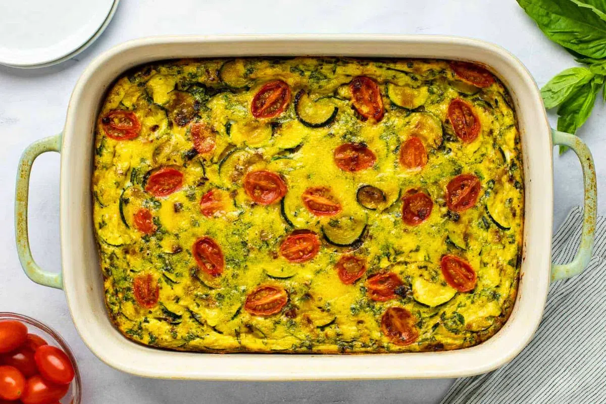 Italian Frittata with Zucchini and Tomato in a baking dish.