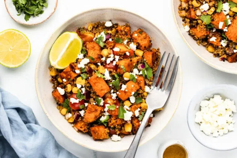 Quinoa Sweet Potato Bowl topped with lemon slices.